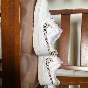 White Nikes with cheetah print
